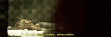 a woman is laying on a bed with the words `` approximately ... eleven million '' written in yellow .