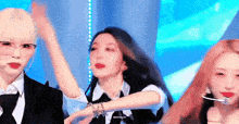 a group of women are dancing on a stage .