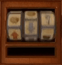 a slot machine is spinning in a wooden box