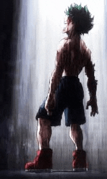 deku from my hero academia is standing in the rain in a dark room .