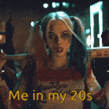 a woman in a harley quinn costume blowing a bubble with the words mein my 20s below her