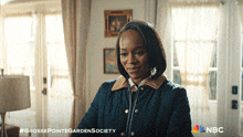 a grosse pointe garden society advertisement with a woman in a living room
