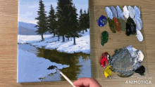 a person is painting a snowy scene with a palette behind them that says made in animotica