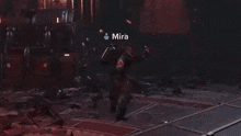 a person is standing in a dark room with a large explosion coming out of it .