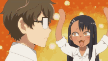 a man and a girl are standing next to each other and the girl is sticking out her tongue