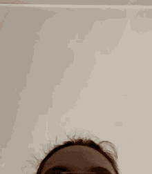 a close up of a person 's middle finger pointing up