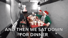 a group of people are sitting at a table with a tray of food in a van .