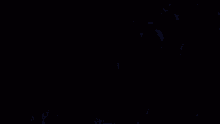 a group of people standing next to each other with a blue heart in the background .