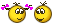 a couple of smiley faces with purple flowers in their eyes on a white background .