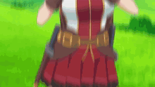 a woman in a red and white dress is standing in a field