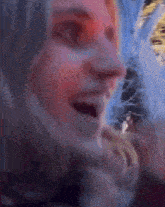 a close up of a woman 's face with a blurry background
