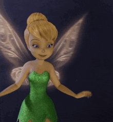 tinkerbell from disney 's tinkerbell is wearing a green dress and wings