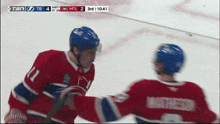 a hockey game is being played and the score is tb 4 mtl 2