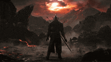 a man is kneeling in front of a volcano with the sun shining through the clouds