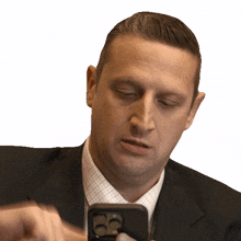 scrolling up tim robinson i think you should leave with tim robinson checking phone browsing on phone