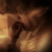 a blurry picture of a man in a suit and tie looking down