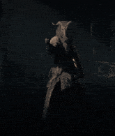 a person with horns on their head is standing in a dark forest