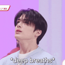 a close up of a person 's face with the words * deep breaths * on the bottom