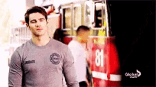a man in a grey shirt with the number 81 on it