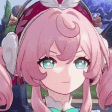 a close up of a pink haired anime girl wearing ear muffs and a bow .