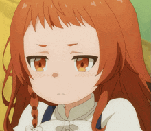 a close up of a girl 's face with red hair and yellow eyes