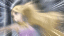 a blurry picture of a girl with blonde hair