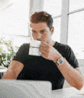 a man drinking from a cup that says appmart on it