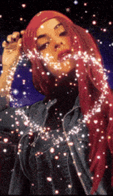 a woman with red hair is surrounded by sparkly lights