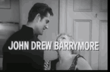 a black and white photo of a man and a woman with the name john drew barrymore on the bottom