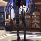 a statue of a woman with long blue hair is standing in a room