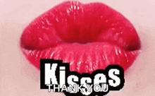a close up of a woman 's red lips with the words `` kisses thank you '' written above it .