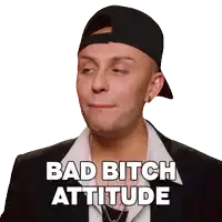 a man wearing a black hat and a suit says bad bitch attitude