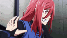 a girl with red hair is wearing a shirt that says team on it