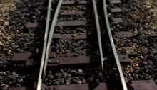 a close up of a train track with a lot of rocks on it