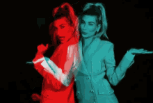a woman in a red and blue jacket is dancing