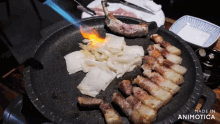 a pan filled with meat and vegetables with the words made in animotica below it