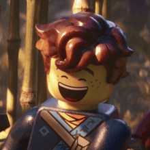a close up of a lego figure laughing