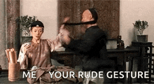 a man is holding a woman 's hair in a room with the words `` me your rude gesture '' behind him .