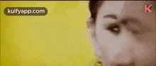 a close up of a woman 's face with the words kulfyapp.com written on the bottom .