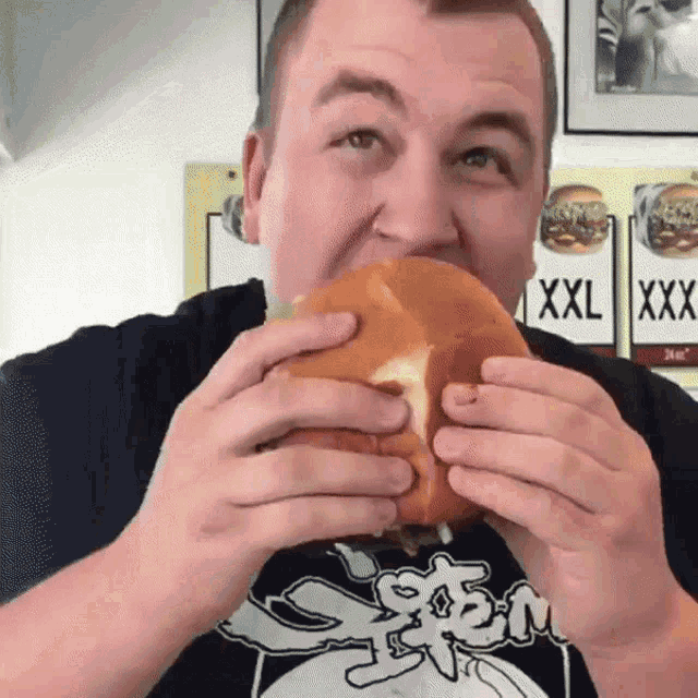 fat guy eating burger