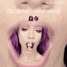 a woman with purple hair is taking a picture of herself with a small doll in her mouth .