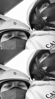 a person wearing a mask and a helmet has the word cal on their hoodie