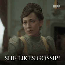 a woman says she likes gossip with a hbo logo behind her