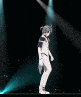 a cartoon character is dancing on a stage with a blue light behind him