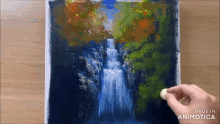 a painting of a waterfall is being made in animatica