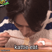 a man is eating noodles with chopsticks and the caption katie eat is below him
