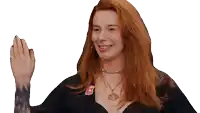 a woman with red hair is wearing a black top and a necklace