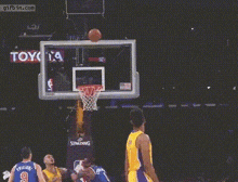 a basketball player for the lakers throws the ball