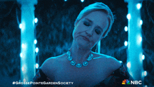 a woman in a blue dress is featured in a nbc advertisement
