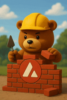 a teddy bear wearing a yellow hard hat is holding a trowel